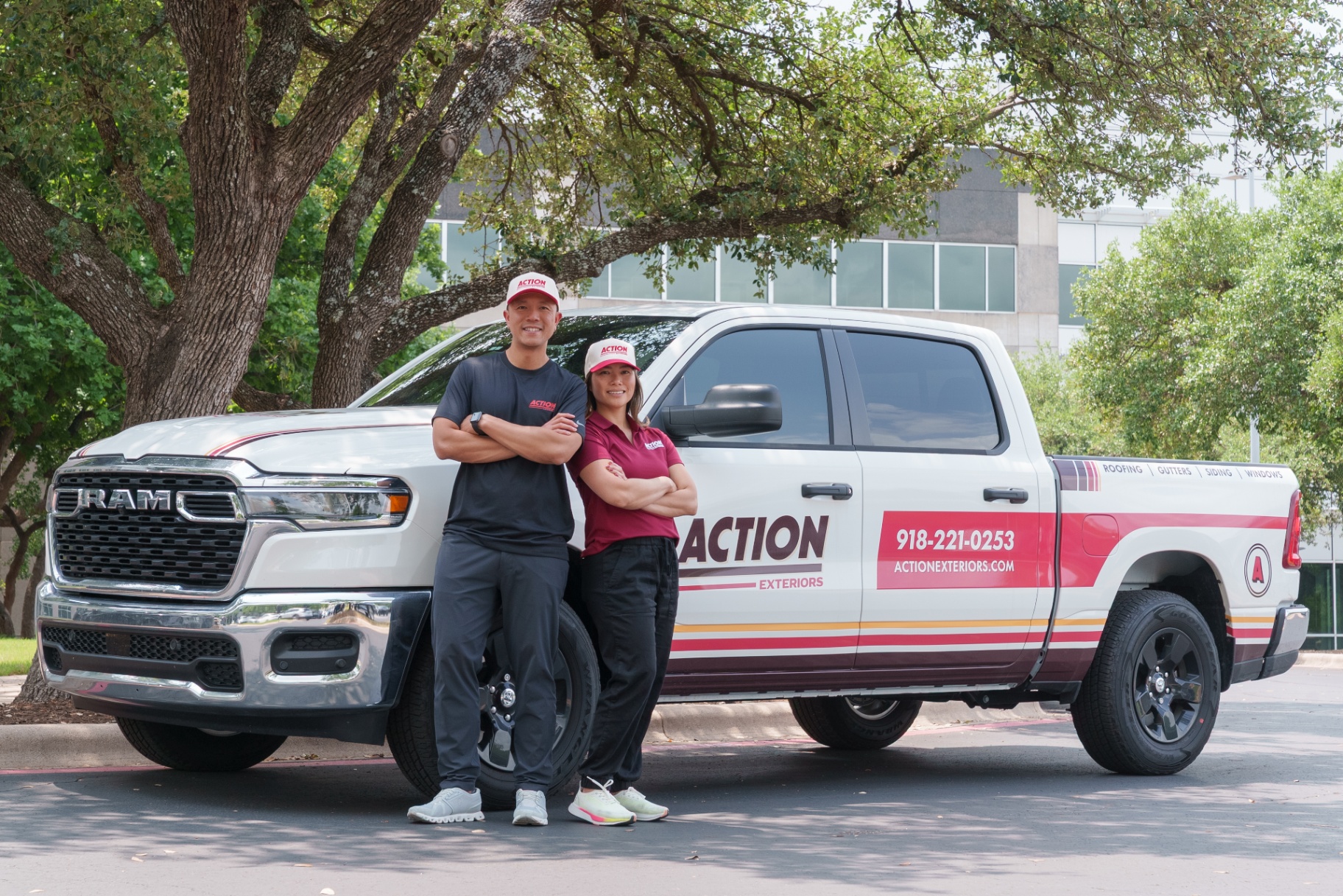 Action Exteriors Tulsa owners Kevin and Kathy in front of company truck