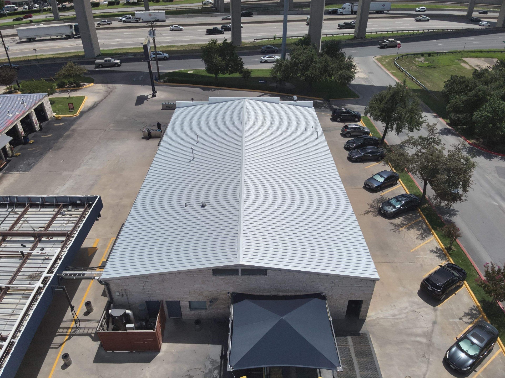 Commercial metal roof installation on DFW business