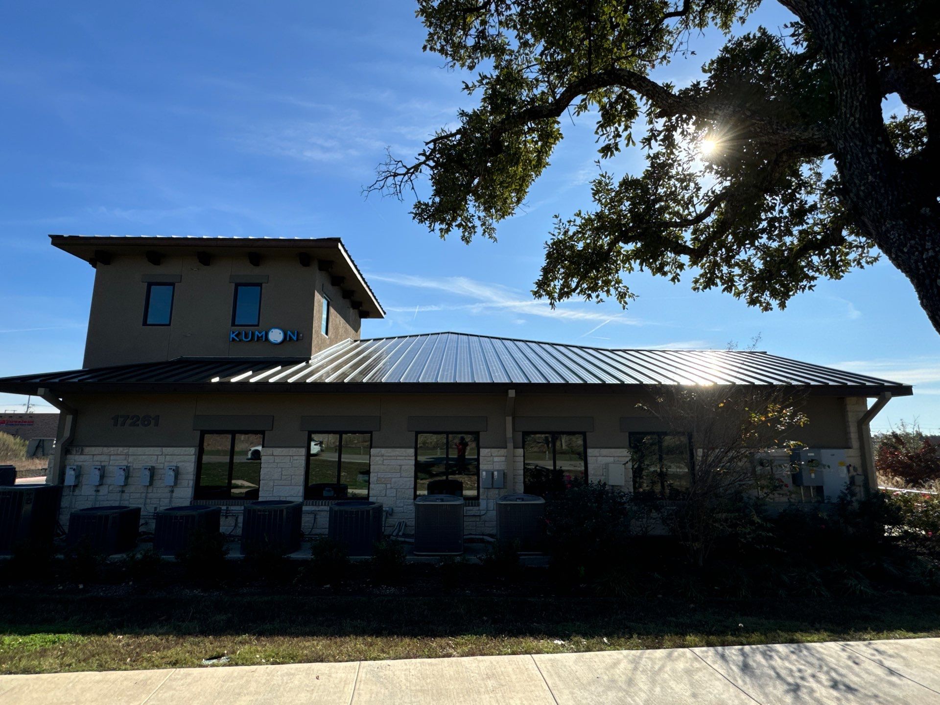 Commercial building with metal roof and storefront