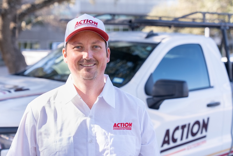 Action Exteriors franchise owner in front of a company truck