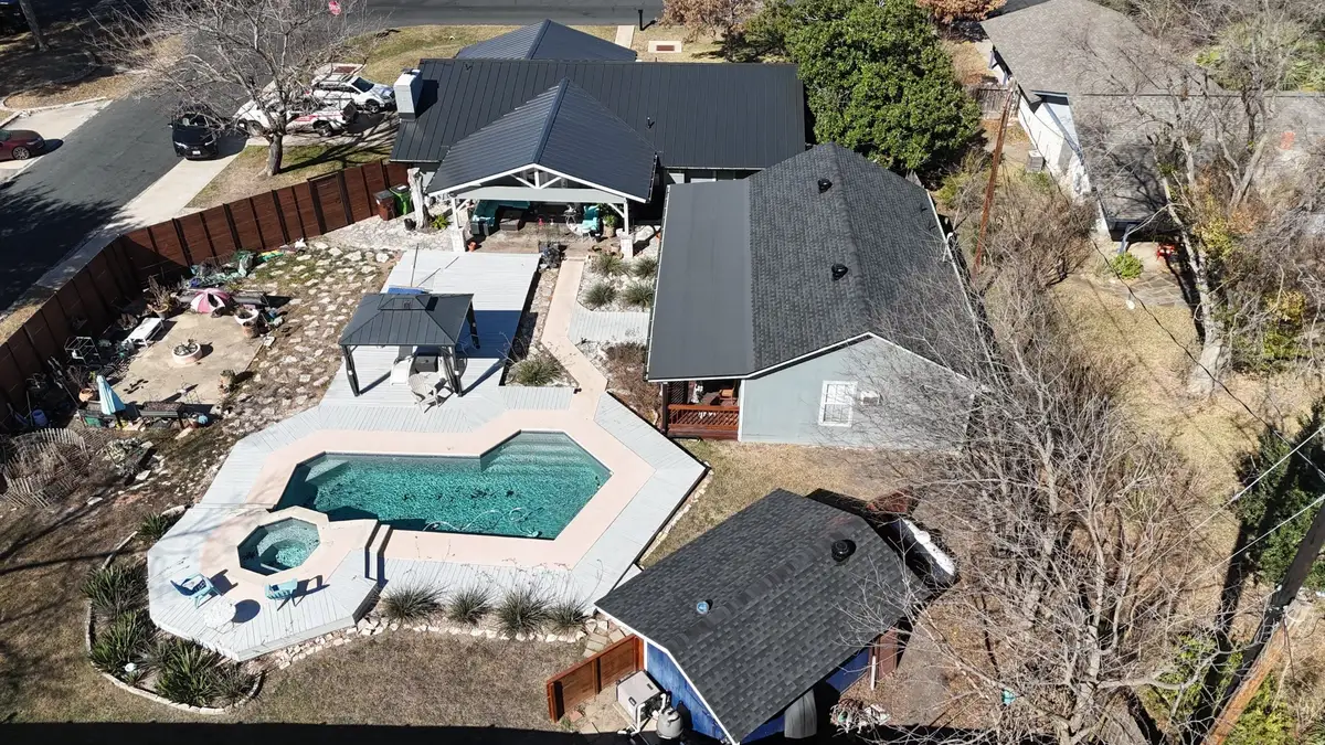 Action Exteriors franchise team in front of branded truck