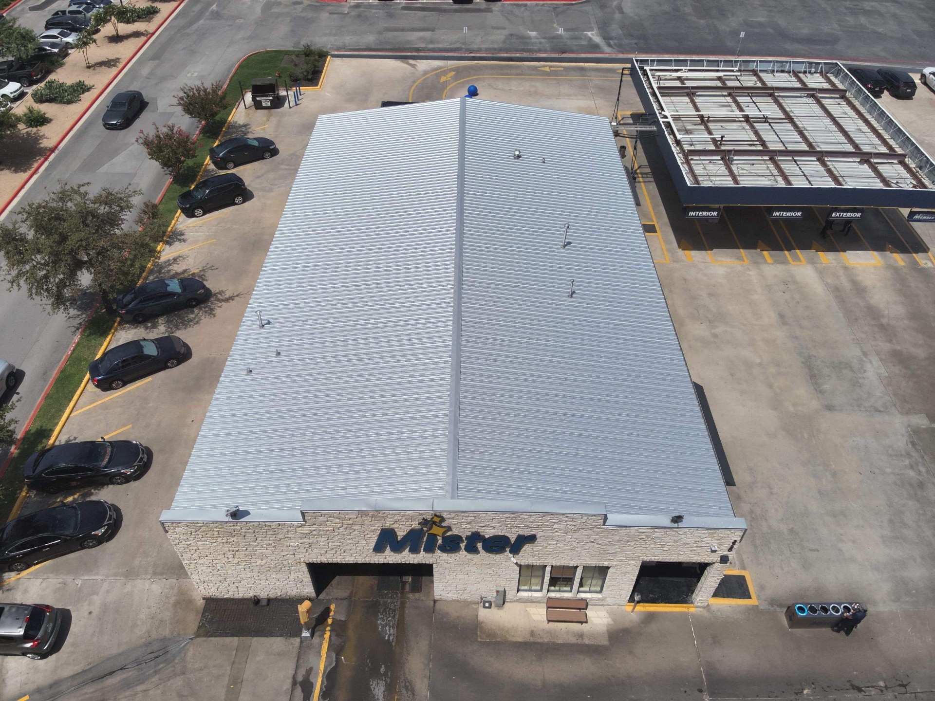 Aerial view of commercial building with new metal roof