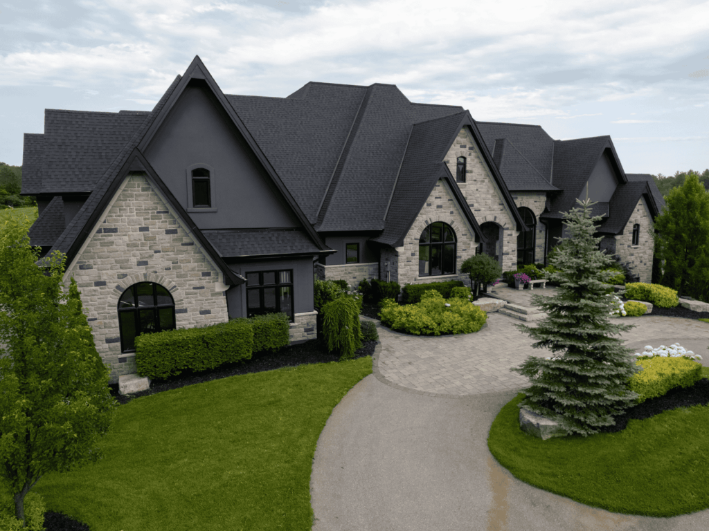 a beautiful black roof home done by action exteriors