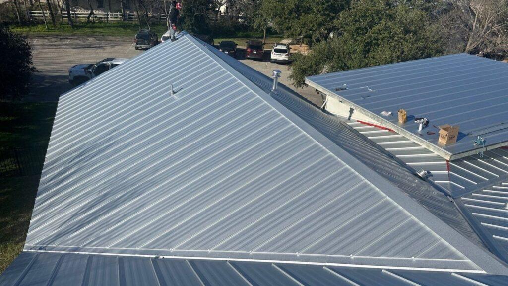 A business had their metal roof commercial roof replacement Action Exteriors Austin.