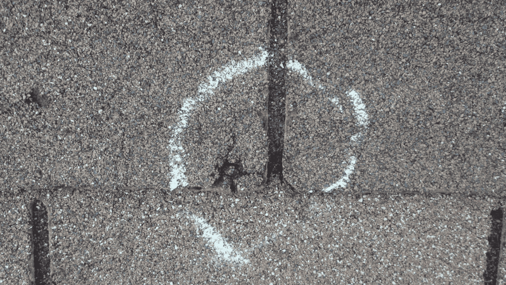 Hail damage to shingles on a roof in Georgetown, texas