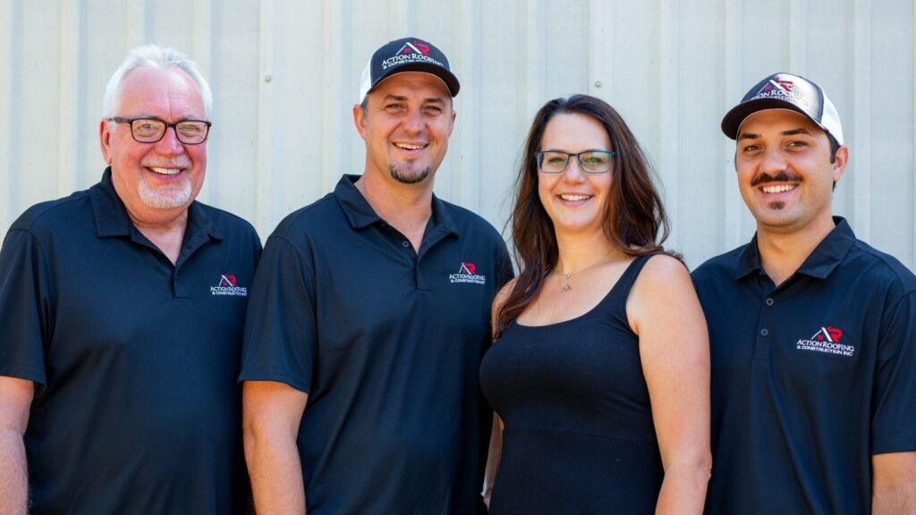 Action Exteriors Austin family owners posing for a photo.