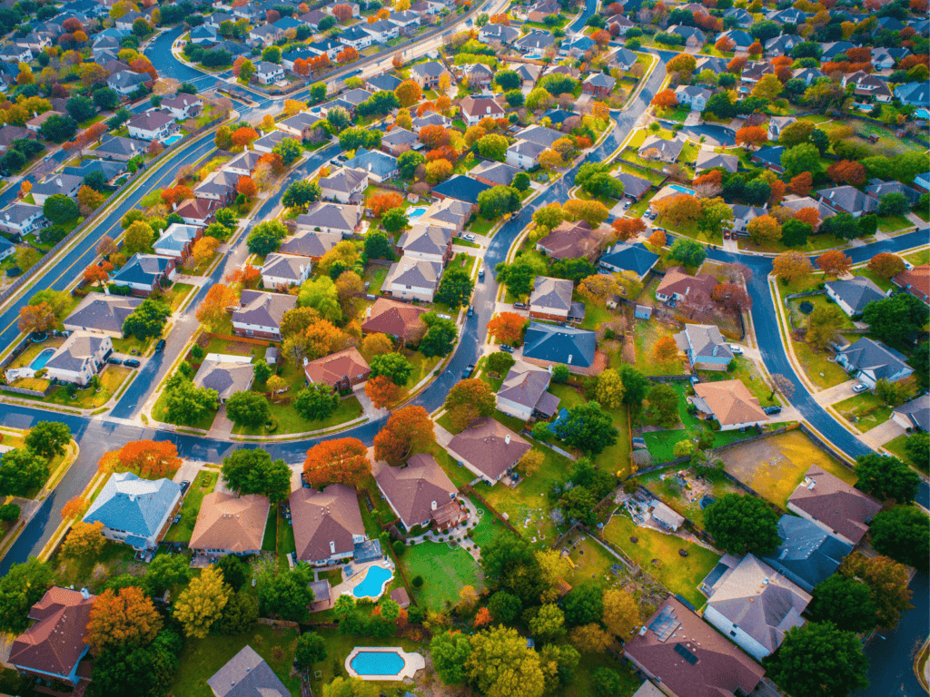 Drone arial shot of neighborhood houses_Action Exteriors_Roofing Repair
