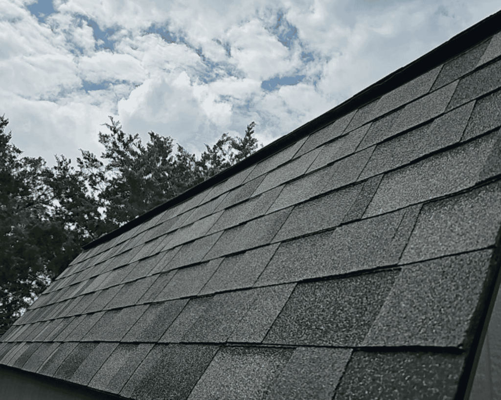 a close up of asphalt shingles on a tulsa home_action exteriors