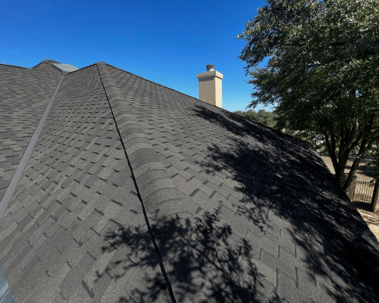a close up of dark gray shingles on a tulsa home_action exteriors