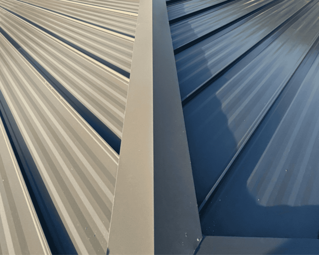 a close up of a metal roofing panel installed by action exteriors tulsa