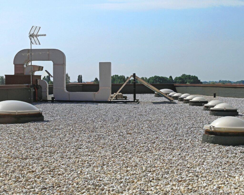 a flat roof of a commercial building_action exteriors