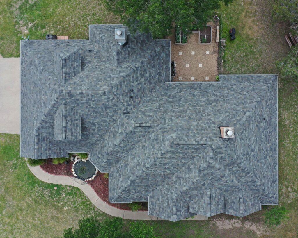 an aerial view of a recently installed roof completed by professional roofers at action exteriors